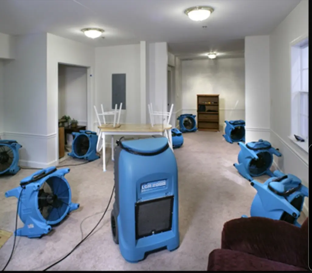 Air movers and dehumidifier setup for Water Damage Restoration in Honeygo